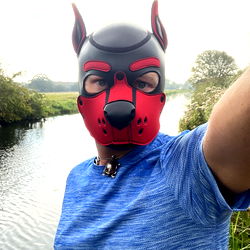 A Person In A Red Dog Mask