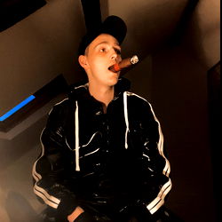 Cigarboii's Pensive Moment with a Cigarette