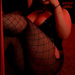 Female OnlyFans Model in Fishnet Stockings