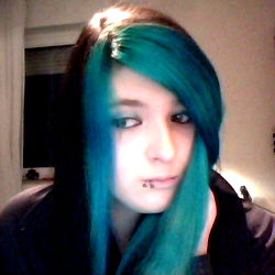 Stylish Akina Vireo: 25-Year-Old German Alternative Model with Neon Blue Hair and Punk Piercings