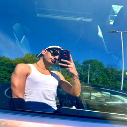 Stylish Fitness Model Taking a Selfie in the Car