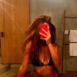 Model Poses in Bathroom