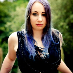 UK OnlyFans Model Sarnia Photos, Striking a Pose in Purple Hair