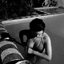 Angel, a stunning OnlyFans model posing in a pool