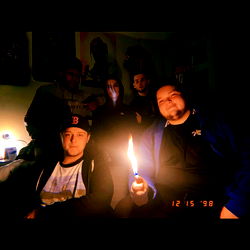 Billy Helms and Friend Enjoying a Candlelit Gathering