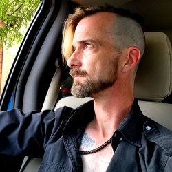 Modern Tattooed Man with Short Hair in Black and White