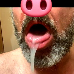 Mature Man with Full Beard and Candy in His Mouth