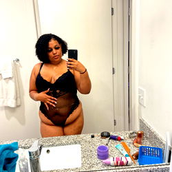 Yummy, an OnlyFans Model, Strikes a Pose in the Mirror