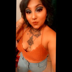 Onlyfans Model Smiles Showcasing a Stylish Look