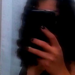 Amatista's Playful Pose with Phone Camera