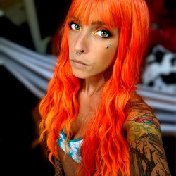 Tawny Allegra - Vivid Tattoos, Orange Hair, Striking Makeup