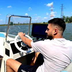 An Athlete in a Speedboat on a Sunny Day