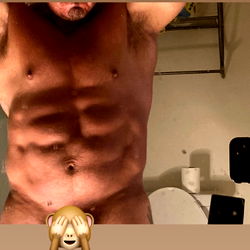 OnlyFans Model Muscle Papi Showcasing Six-Pack Abs