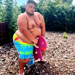 Adriantrejochubby, a Fitness Model in Casual Clothing, Showing Off His Muscles
