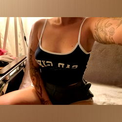 A Stylish Model Showcasing Her Tattoos and Personal Style