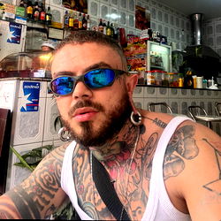 Tattooed Man in T-shirt, Sunglasses and Tattoos