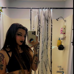 Model in Bathroom Mirror