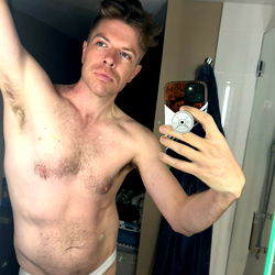 Fitness Model Taking a Mirror Selfie