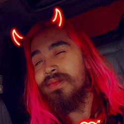 A Person with Pink Hair and a Red Heart on the Nose