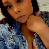 Charisma, OnlyFans model, in a denim jacket