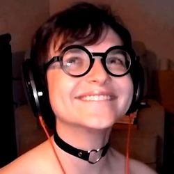 Joey, a Canadian influencer with a playful and quirky style, wearing glasses and a choker.