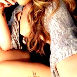 Arora Aries in Tattoo-themed Outfit, Smiling