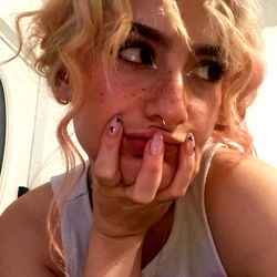 Dani Sky, a captivating model from OnlyFans in her bedroom