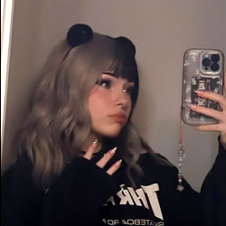 A Stylized Model Showcasing Their Look in a Selfie