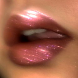 Sensual Lip Gloss Ad with Shimmery Copper Tones and Pink Dots