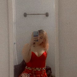 Amber in a Mirror with Red Dress and Fishnet Stockings
