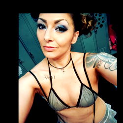 Fashion Model Miss Novah Caine Posing in a Bold Outfit with Tattoos