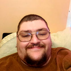 A Man with a Mustache and Glasses