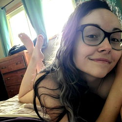 Canadian Woman Relaxing on Bed