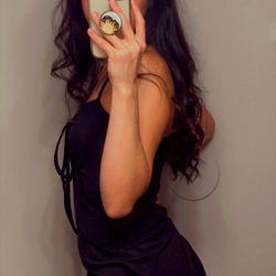 Model Qutebutt in a Sleek Black Dress