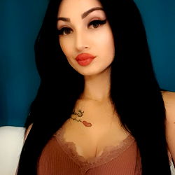 Ionela, a Gorgeous OnlyFans Model with Stunning Long Hair and Tattoos