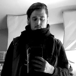 Stylish man in black and white photo with cell phone