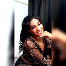 Barbie, a model from the Dominican Republic, captures a moment of joy on OnlyFans