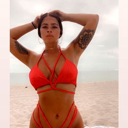 Allirene in a Red Swimsuit at the Beach