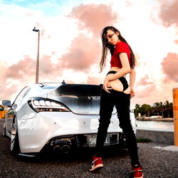 Astro Model Standing Next to a Car