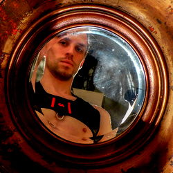 Fitness Model Alex Heat in Mirror, Reflecting His Body