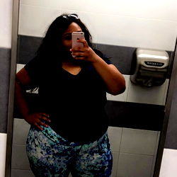 Model Lexy Standing in a Bathroom