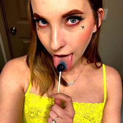 Ava Jade's Playful Pose with Gum and Nail Polish