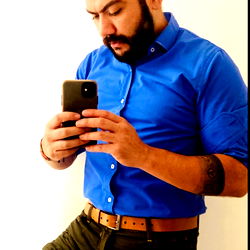 Gucho, a model from Colombia captures his look in a smartphone mirror selfie.