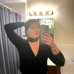 Confident Model in Mirror Selfie with Camera Phone