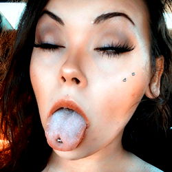 Dolly Curves: A Seductive Tattooed Model Showcasing Her Unique Style