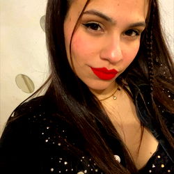 Tami Cabrera, a captivating model with vibrant red lips and flowing dark hair