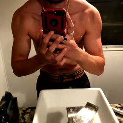 Muscular Man Taking Selfie in Bathroom