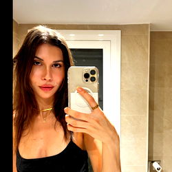 Model in a Bathroom Mirror Selfie