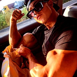 OnlyFans Model Amor Flaunting Muscular Arms in Car