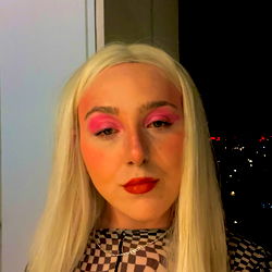 Pattie in a Checkered Jumpsuit with Blonde Wig and Pink Makeup